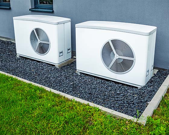 two well maintained and serviced air source heat pumps